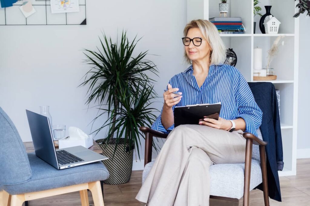 A therapist performing an online consultation with her patient