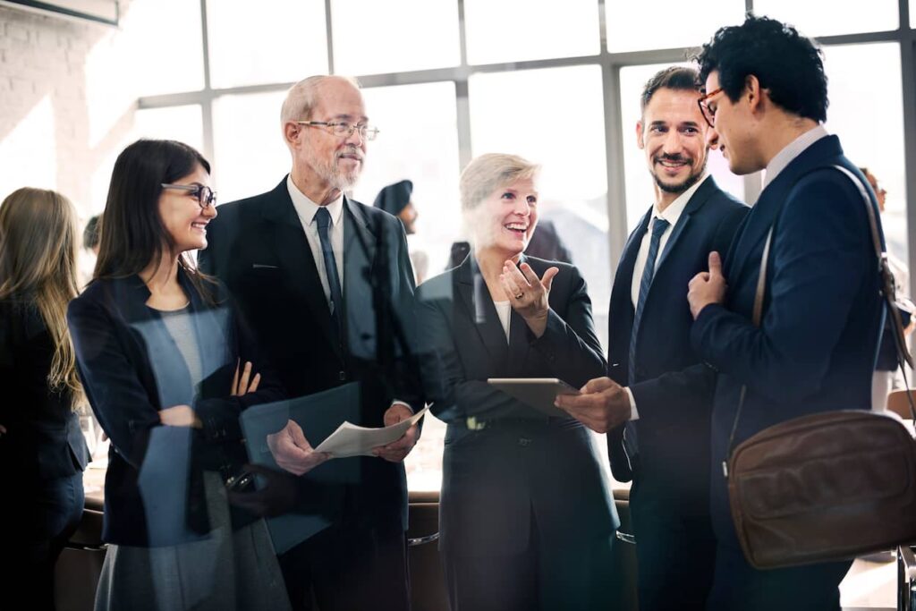 A group of people networking at a conference.